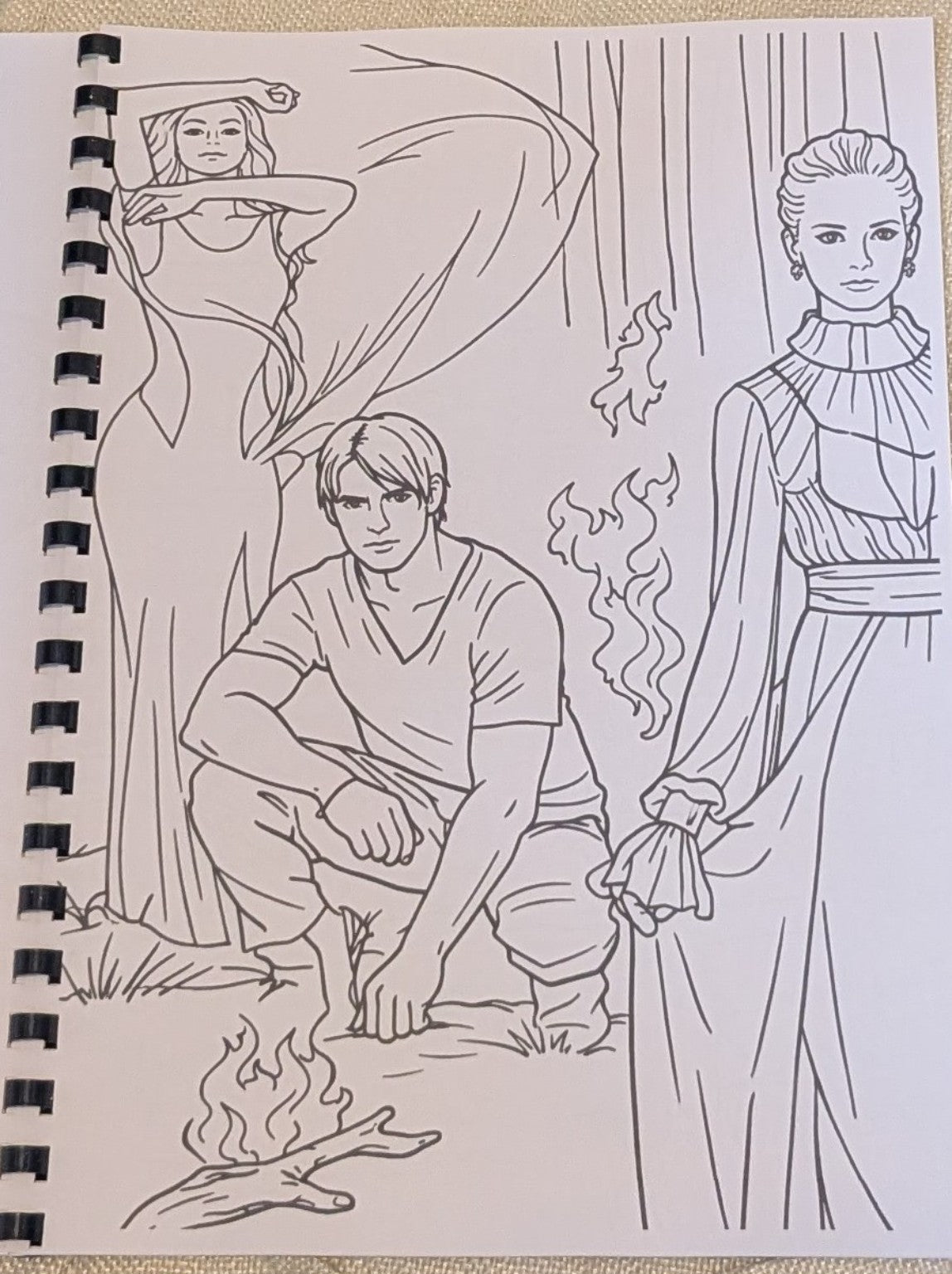 Sample colouring page with a campfire scene