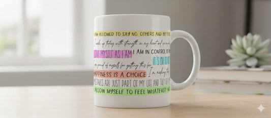 Mug with motivational phrases on a desk with a blurred background