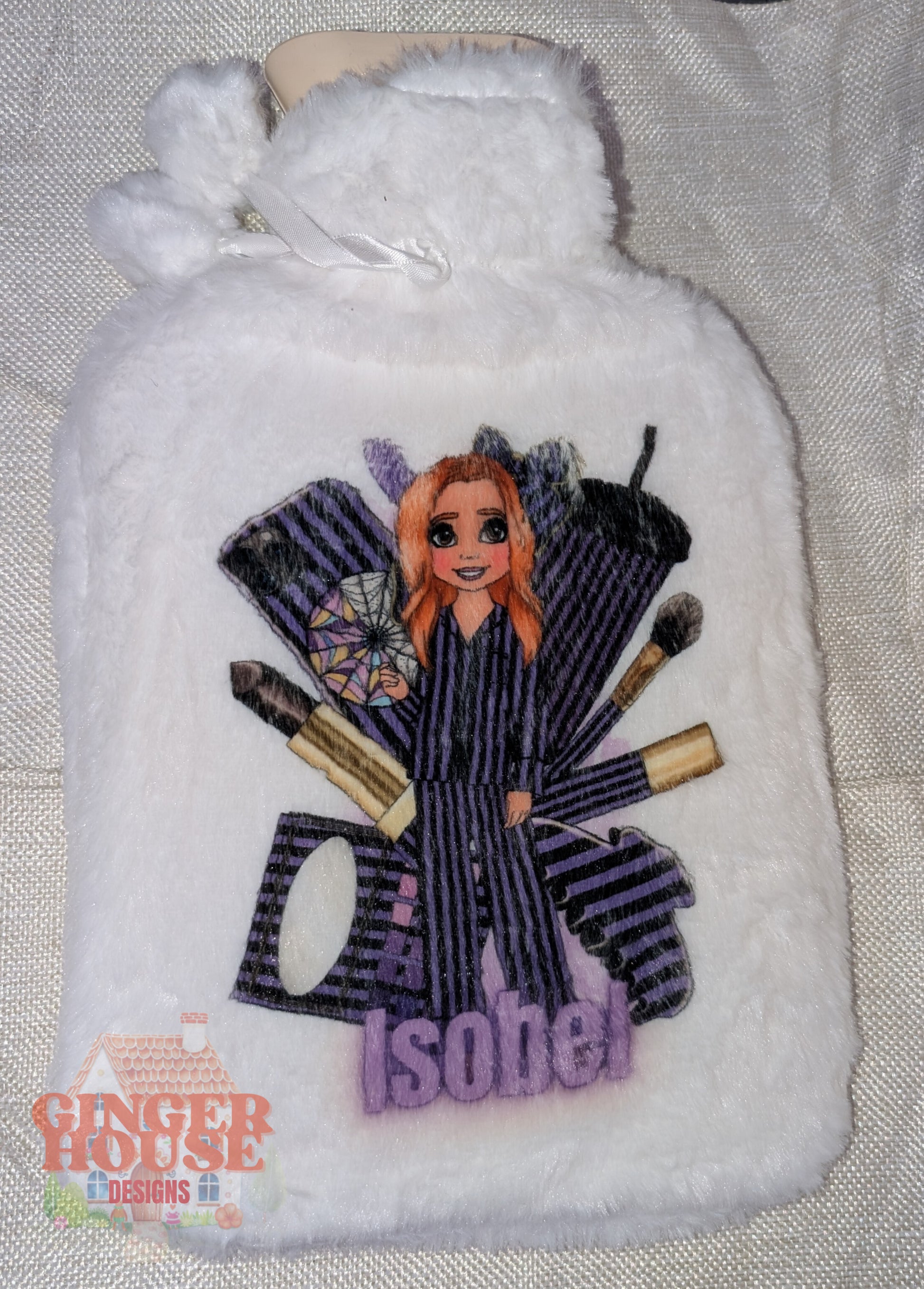 White hot water bottle with a character design and 'Ginger House' branding.